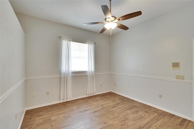 unfurnished room with ceiling fan and light wood-type flooring