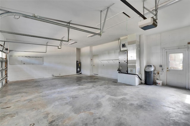 garage featuring electric water heater and a garage door opener