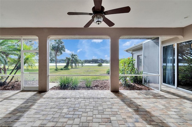 view of patio featuring ceiling fan