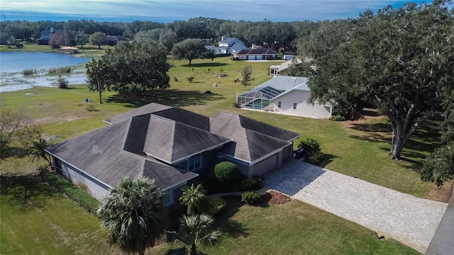 birds eye view of property with a water view