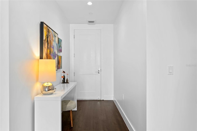 hallway featuring dark wood-type flooring