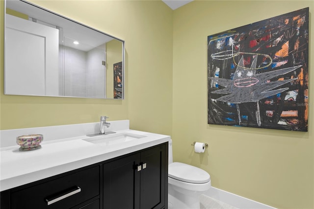 bathroom with toilet and vanity