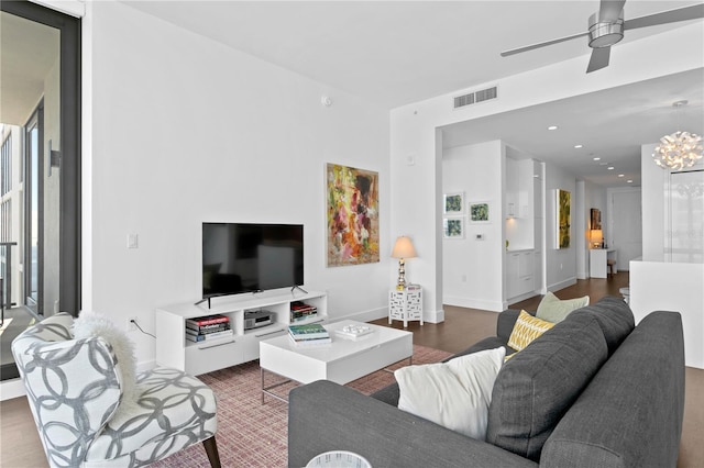 living room with ceiling fan and hardwood / wood-style flooring