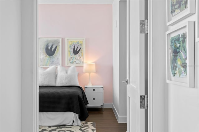 bedroom featuring dark wood-type flooring