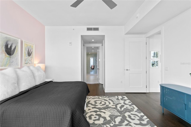 bedroom with ceiling fan and dark hardwood / wood-style flooring