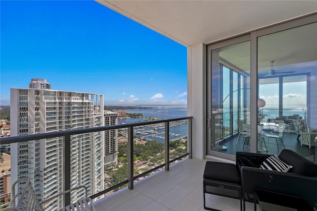 balcony featuring a water view