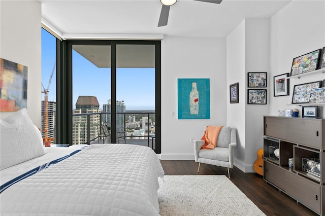 bedroom with ceiling fan, dark hardwood / wood-style flooring, access to outside, and floor to ceiling windows