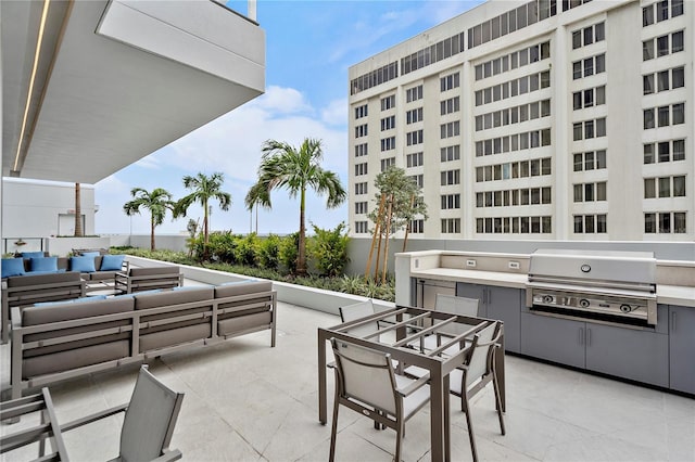 view of patio featuring an outdoor kitchen, outdoor lounge area, and grilling area