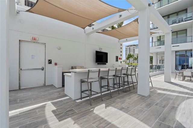 view of patio with a bar