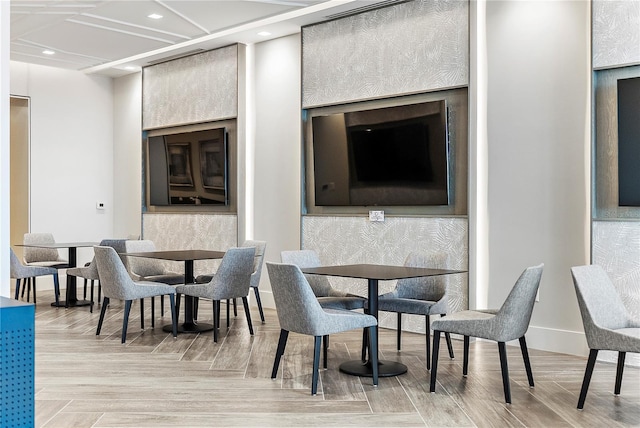 dining space featuring light parquet flooring