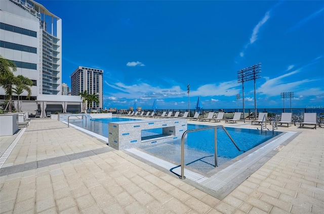 view of swimming pool with a patio