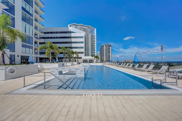 view of swimming pool with a patio