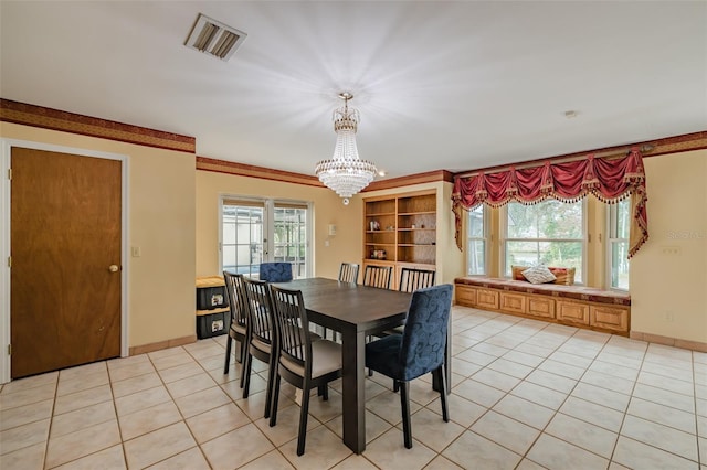 dining room featuring french doors, light tile patterned flooring, and an inviting chandelier