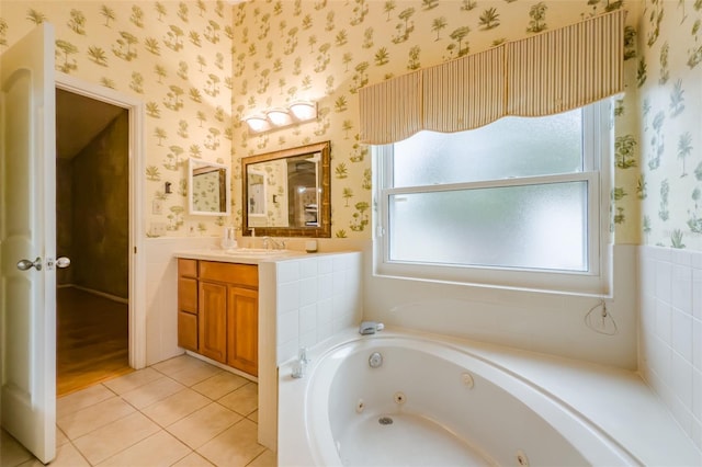 bathroom with vanity, a bath, and tile patterned flooring