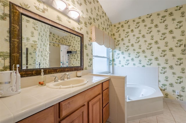 bathroom featuring independent shower and bath, tile patterned floors, and vanity