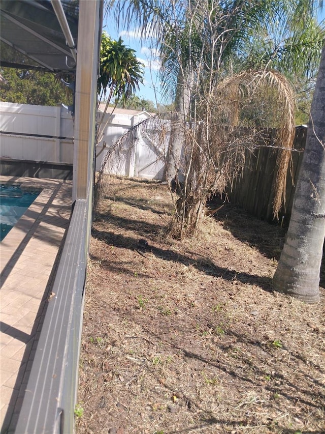 view of yard with a fenced backyard