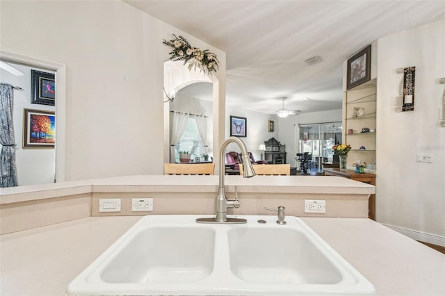 kitchen featuring sink and ceiling fan