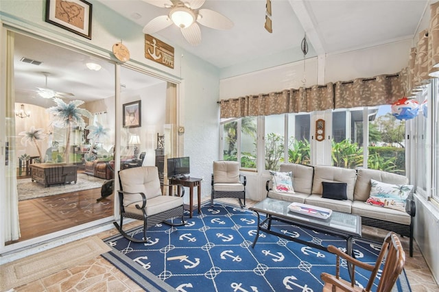 sunroom / solarium with ceiling fan