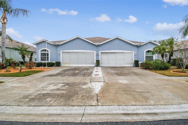 single story home featuring a garage