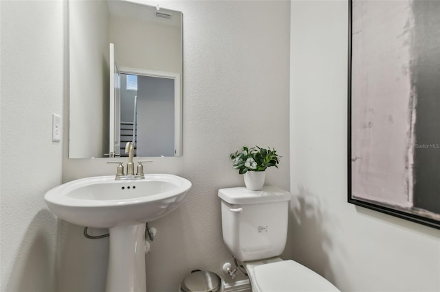 bathroom featuring toilet