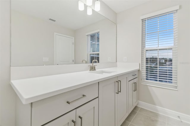 bathroom with vanity and tile patterned flooring