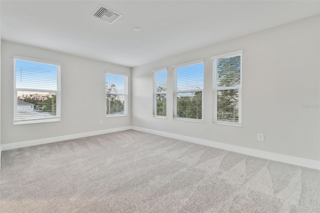 unfurnished room with carpet floors