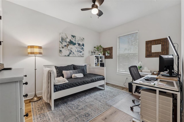 bedroom featuring light hardwood / wood-style flooring and ceiling fan