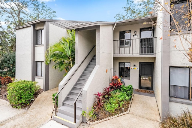 entrance to property with a balcony