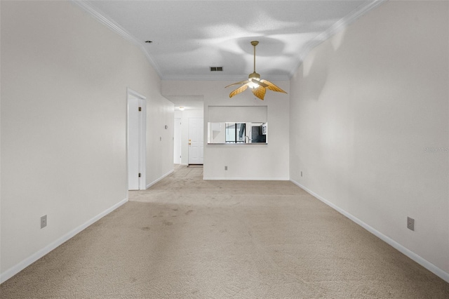 unfurnished living room featuring light carpet, ceiling fan, and crown molding