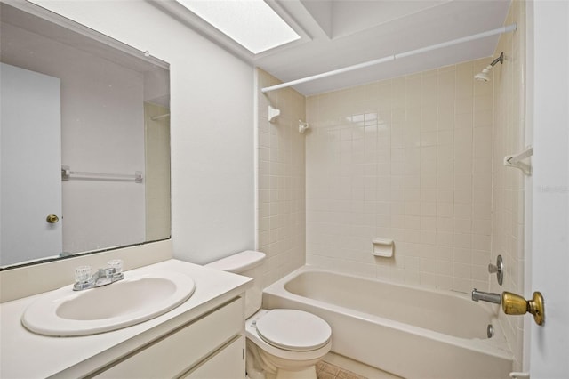 full bathroom with toilet, tiled shower / bath combo, and vanity