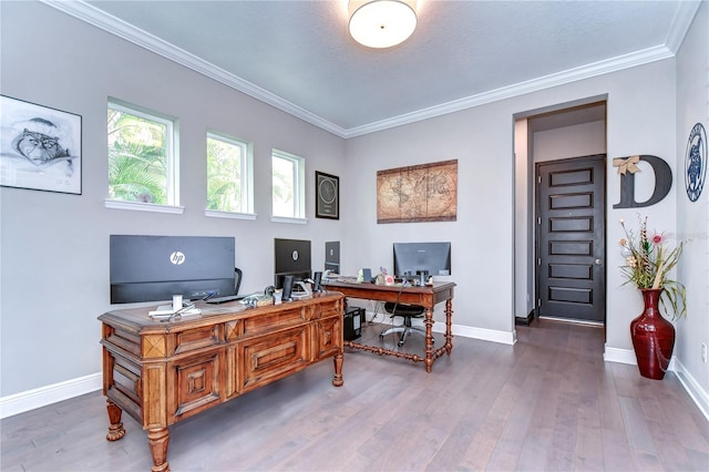 office area with ornamental molding and hardwood / wood-style flooring