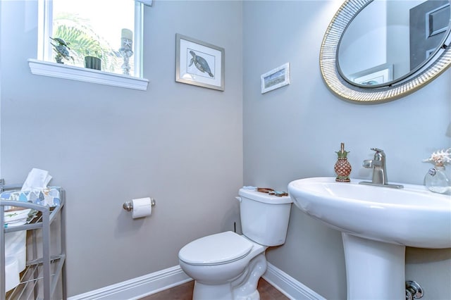 bathroom with toilet and sink