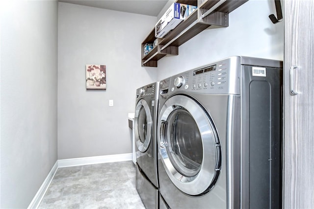 clothes washing area with washer and dryer