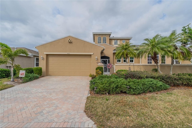 mediterranean / spanish-style home featuring a garage