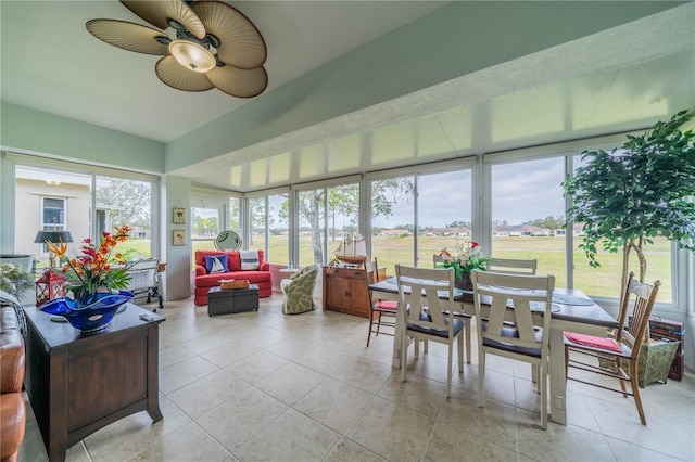 sunroom featuring ceiling fan