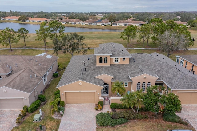 birds eye view of property with a water view