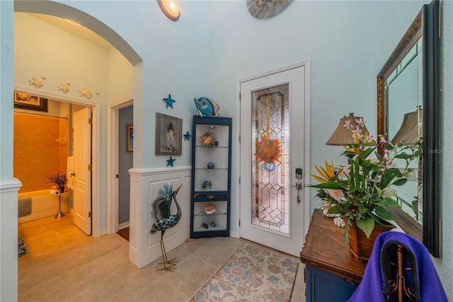 foyer featuring light tile patterned flooring