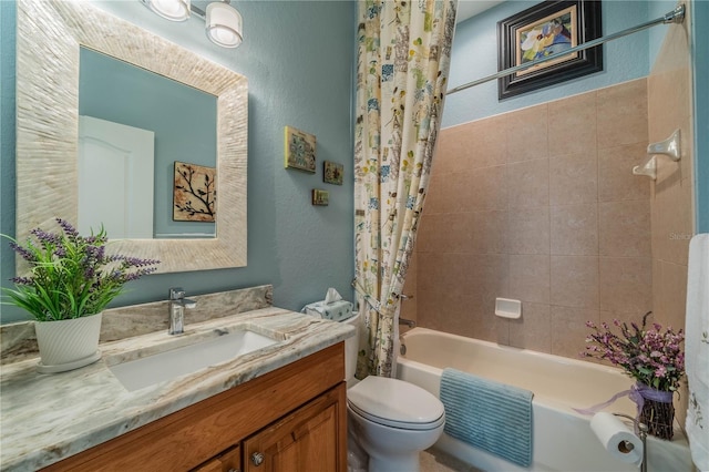 full bathroom featuring shower / tub combo with curtain, vanity, and toilet