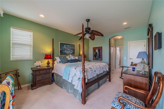 bedroom with ceiling fan and light colored carpet