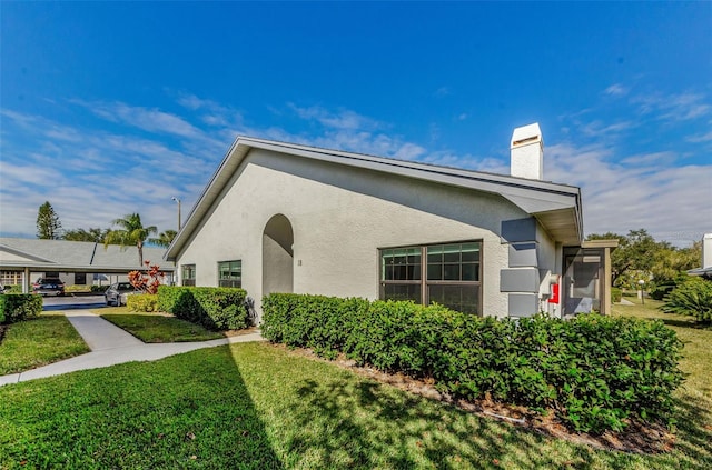 exterior space with a front lawn