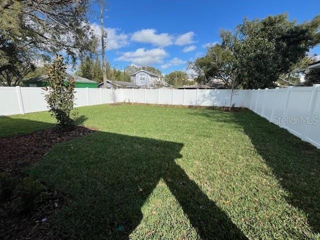 view of yard featuring a fenced backyard