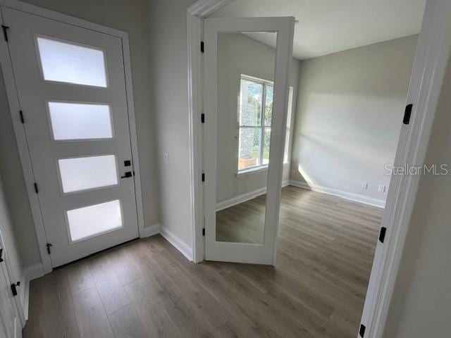 entrance foyer with light wood-style flooring and baseboards