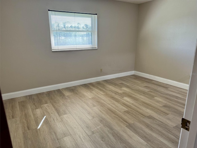 unfurnished room with light hardwood / wood-style flooring