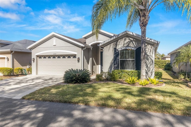 view of front facade with a garage and a front yard