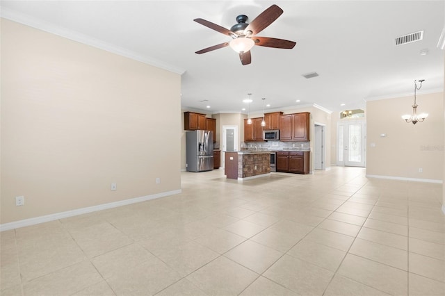 unfurnished living room with ornamental molding, ceiling fan with notable chandelier, and light tile patterned floors