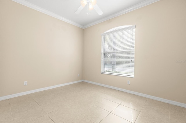 tiled spare room featuring crown molding and ceiling fan