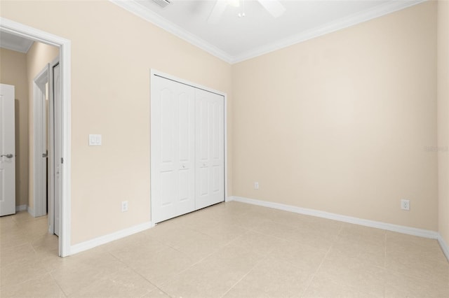 unfurnished bedroom with ornamental molding, a closet, and ceiling fan