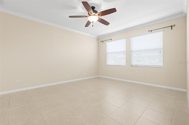 spare room with ornamental molding and ceiling fan