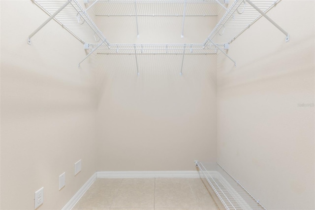 walk in closet featuring light tile patterned floors