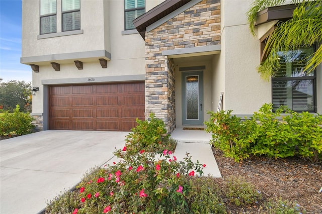 view of exterior entry featuring a garage